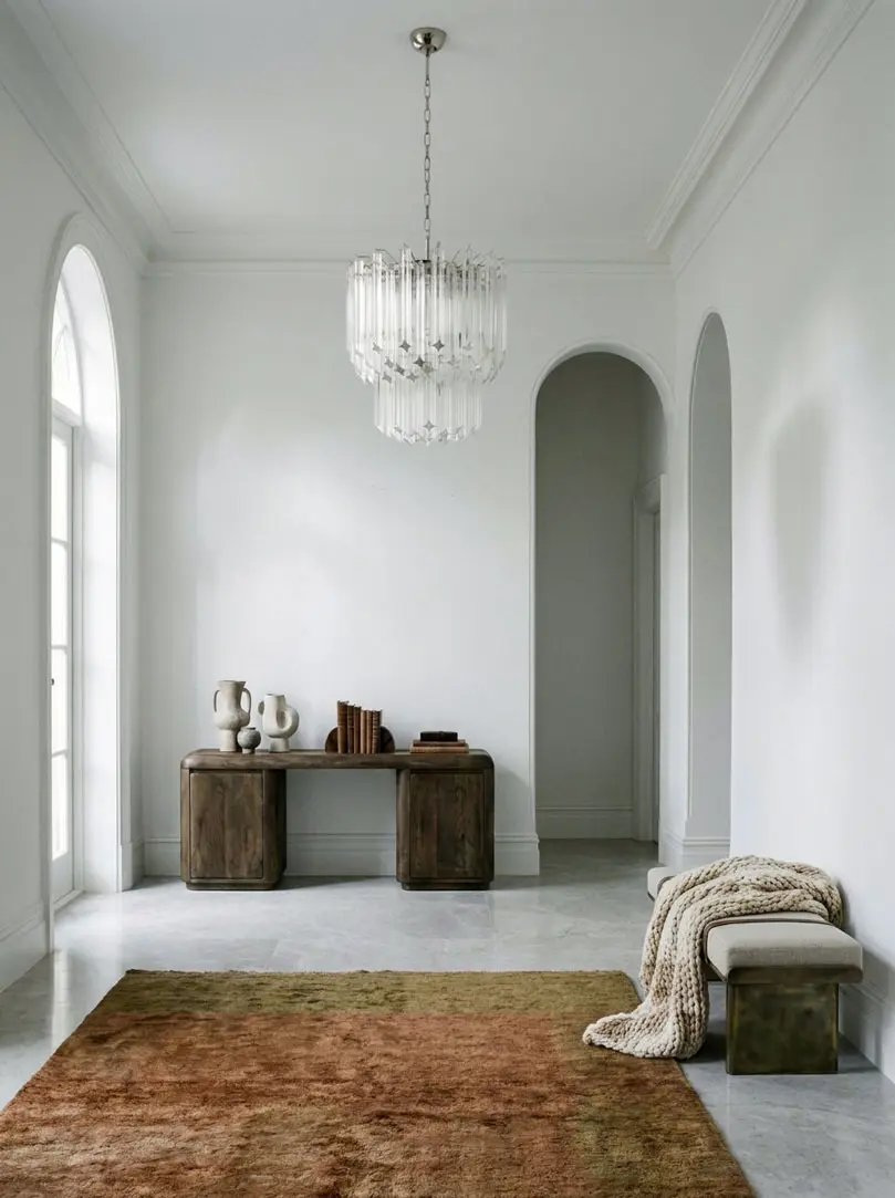 107 transparent Murano prism chandelier hanging in a hallway