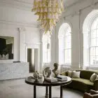 85 lattimo leaves Murano chandelier hanging in a hotel lobby