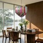163 multi color prism Murano chandelier hanging in diningroom with a lake view