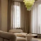 80 green Murano glass tube chandelier hanging in livingroom