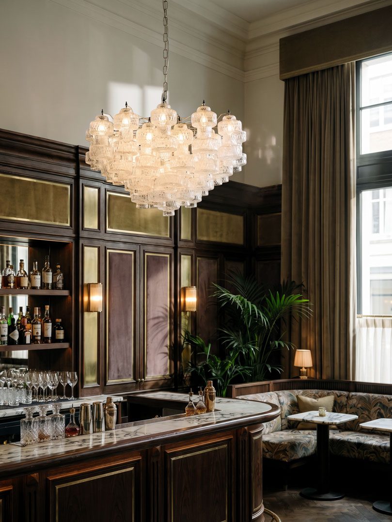 37 clear Murano glass chandelier hanging in a bar